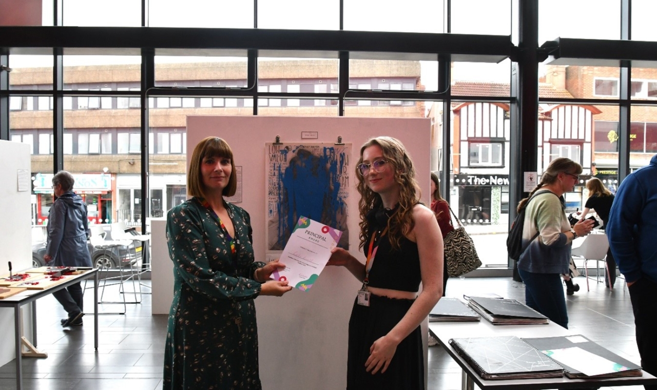 Photograph - L-R Kelly Rinaldi, Principal at Barnsley Sixth Form College presenting a certificate to A Level Art and Design student Emily Arnold