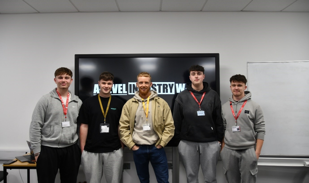 Photograph - Left to right students Jake Wilkinson, Alfie Exton, Harvey Roby-Watson and Freddie Johnson, with Pete Shaw owner of Barnsley Barbell (centre).